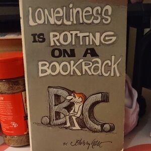 Loneliness is Rotting on a Bookrack by John McPherson
